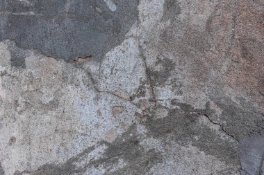 Doku, duvar, beton, arka plan olarak kullanılabilir. Çizik ve çatlaklarla dolu bir duvar parçası.