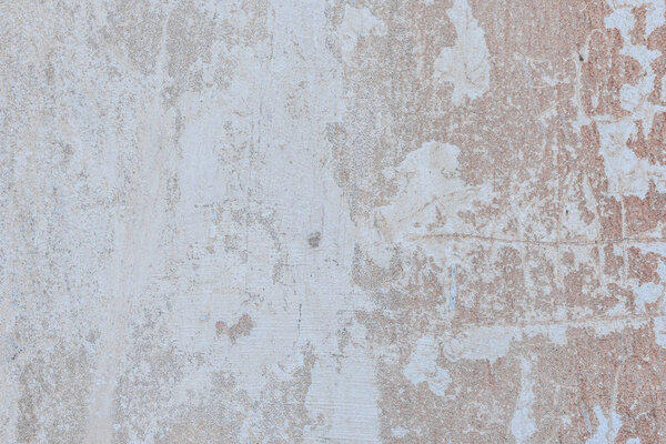 Текстура, стена, бетон, его можно использовать в качестве фона. Фрагмент стены с царапинами и трещинами