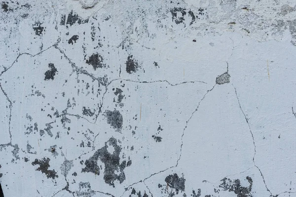 Doku, duvar, beton, arka plan olarak kullanılabilir. Çizik ve çatlaklarla dolu bir duvar parçası.