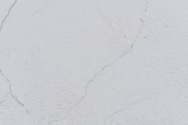 Doku, duvar, beton, arka plan olarak kullanılabilir. Çizik ve çatlaklarla dolu bir duvar parçası.