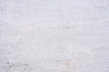 Doku, duvar, beton, arka plan olarak kullanılabilir. Çizik ve çatlaklarla dolu bir duvar parçası.