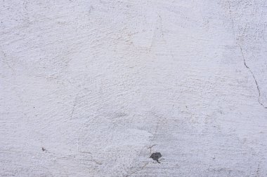 Doku, duvar, beton, arka plan olarak kullanılabilir. Çizik ve çatlaklarla dolu bir duvar parçası.