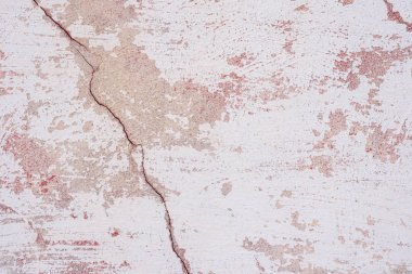 Doku, duvar, beton, arka plan olarak kullanılabilir. Çizik ve çatlaklarla dolu bir duvar parçası.