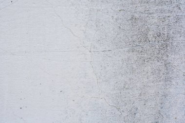 Doku, duvar, beton, arka plan olarak kullanılabilir. Çizik ve çatlaklarla dolu bir duvar parçası.