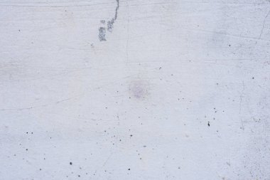 Doku, duvar, beton, arka plan olarak kullanılabilir. Çizik ve çatlaklarla dolu bir duvar parçası.