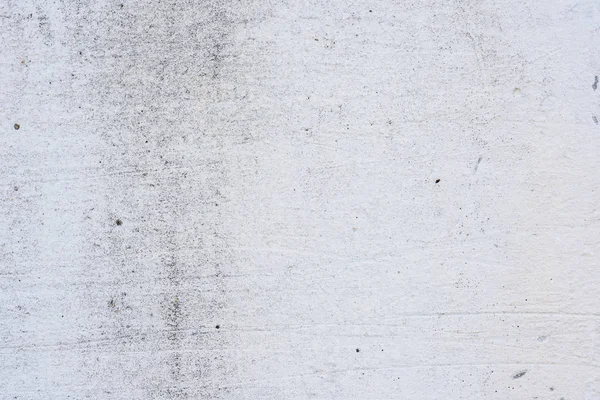 Doku, duvar, beton, arka plan olarak kullanılabilir. Çizik ve çatlaklarla dolu bir duvar parçası.