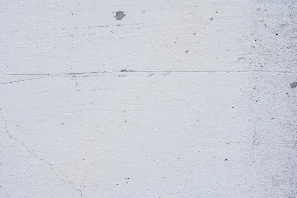 Doku, duvar, beton, arka plan olarak kullanılabilir. Çizik ve çatlaklarla dolu bir duvar parçası.