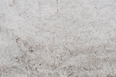 Doku, duvar, beton, arka plan olarak kullanılabilir. Çizik ve çatlaklarla dolu bir duvar parçası.