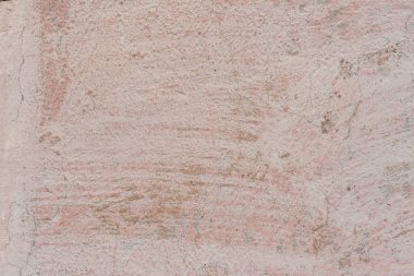 Doku, duvar, beton, arka plan olarak kullanılabilir. Çizik ve çatlaklarla dolu bir duvar parçası.