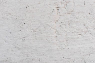 Doku, duvar, beton, arka plan olarak kullanılabilir. Çizik ve çatlaklarla dolu bir duvar parçası.