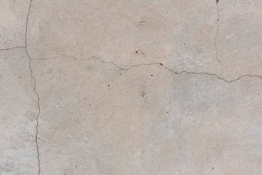 Doku, duvar, beton, arka plan olarak kullanılabilir. Çizik ve çatlaklarla dolu bir duvar parçası.