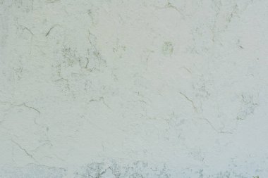 Doku, duvar, beton, arka plan olarak kullanılabilir. Çizik ve çatlaklarla dolu bir duvar parçası.