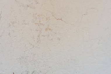 Doku, duvar, beton, arka plan olarak kullanılabilir. Çizik ve çatlaklarla dolu bir duvar parçası.