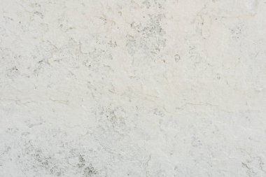 Doku, duvar, beton, arka plan olarak kullanılabilir. Çizik ve çatlaklarla dolu bir duvar parçası.