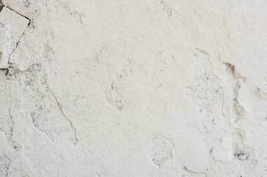 Doku, duvar, beton, arka plan olarak kullanılabilir. Çizik ve çatlaklarla dolu bir duvar parçası.