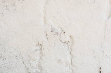 Doku, duvar, beton, arka plan olarak kullanılabilir. Çizik ve çatlaklarla dolu bir duvar parçası.