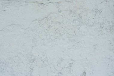 Doku, duvar, beton, arka plan olarak kullanılabilir. Çizik ve çatlaklarla dolu bir duvar parçası.