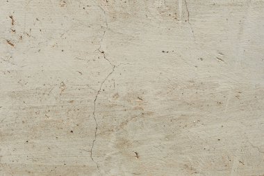 Çatlakları ve çizikleri olan beton bir duvarın dokusu arka plan olarak kullanılabilir.