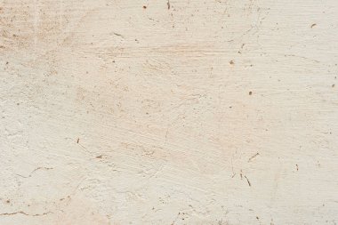 Çatlakları ve çizikleri olan beton bir duvarın dokusu arka plan olarak kullanılabilir.