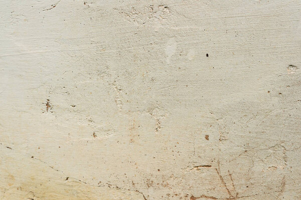 текстура бетонной стены с трещинами и царапинами, которые могут быть использованы в качестве фона