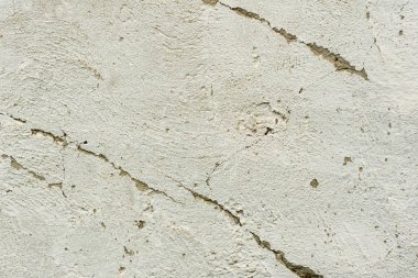 Doku, duvar, beton, arka plan olarak kullanılabilir. Çizik ve çatlaklarla dolu bir duvar parçası.