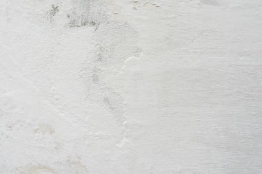 Çatlakları ve çizikleri olan beton bir duvarın dokusu arka plan olarak kullanılabilir.