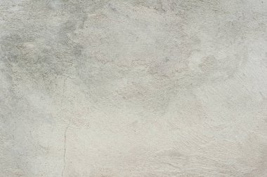 Çatlakları ve çizikleri olan beton bir duvarın dokusu arka plan olarak kullanılabilir.