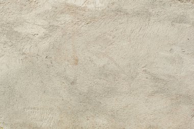 Çatlakları ve çizikleri olan beton bir duvarın dokusu arka plan olarak kullanılabilir.