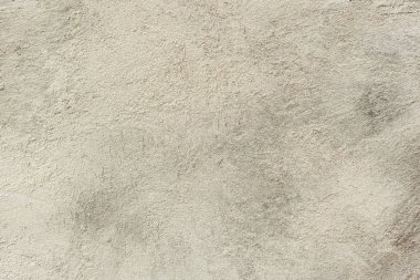 Çatlakları ve çizikleri olan beton bir duvarın dokusu arka plan olarak kullanılabilir.