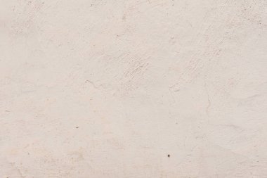 Çatlakları ve çizikleri olan beton bir duvarın dokusu arka plan olarak kullanılabilir.