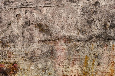 Çatlakları ve çizikleri olan beton bir duvarın dokusu arka plan olarak kullanılabilir.