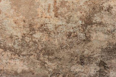 Çatlakları ve çizikleri olan beton bir duvarın dokusu arka plan olarak kullanılabilir.