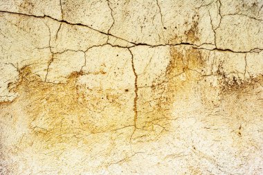 Çatlakları ve çizikleri olan beton bir duvarın dokusu arka plan olarak kullanılabilir.