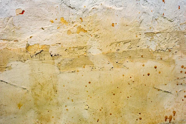 Çatlakları ve çizikleri olan beton bir duvarın dokusu arka plan olarak kullanılabilir.