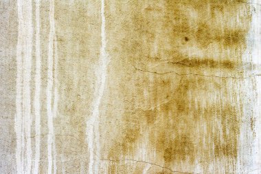 Çatlakları ve çizikleri olan beton bir duvarın dokusu arka plan olarak kullanılabilir.