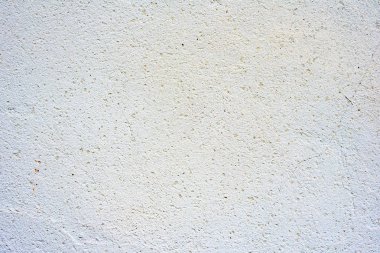 Çatlakları ve çizikleri olan beton bir duvarın dokusu arka plan olarak kullanılabilir.