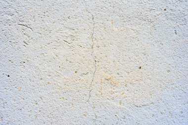 Çatlakları ve çizikleri olan beton bir duvarın dokusu arka plan olarak kullanılabilir.