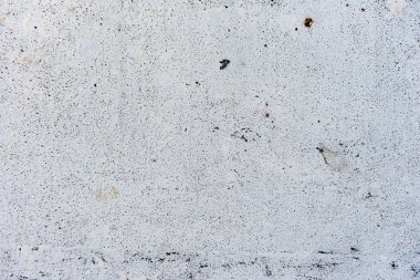 Çatlakları ve çizikleri olan beton bir duvarın dokusu arka plan olarak kullanılabilir.