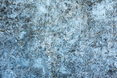 Çatlakları ve çizikleri olan beton bir duvarın dokusu arka plan olarak kullanılabilir.