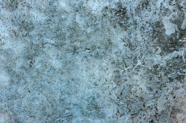 Çatlakları ve çizikleri olan beton bir duvarın dokusu arka plan olarak kullanılabilir.