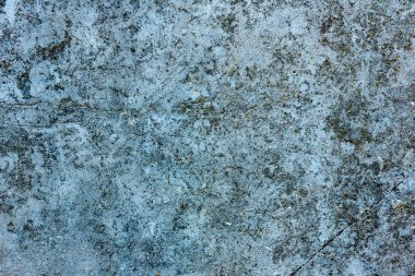 Çatlakları ve çizikleri olan beton bir duvarın dokusu arka plan olarak kullanılabilir.