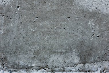 Çatlakları ve çizikleri olan beton bir duvarın dokusu arka plan olarak kullanılabilir.