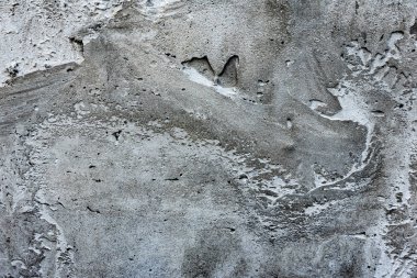 Çatlakları ve çizikleri olan beton bir duvarın dokusu arka plan olarak kullanılabilir.