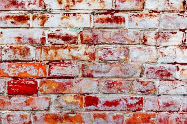Çatlakları ve çizikleri olan tuğla duvar dokusu arka plan olarak kullanılabilir.