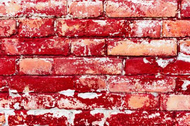 Çatlakları ve çizikleri olan tuğla duvar dokusu arka plan olarak kullanılabilir.