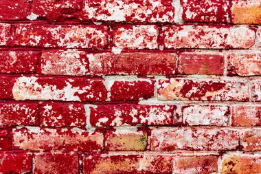 Çatlakları ve çizikleri olan tuğla duvar dokusu arka plan olarak kullanılabilir.