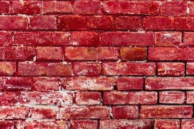 Çatlakları ve çizikleri olan tuğla duvar dokusu arka plan olarak kullanılabilir.