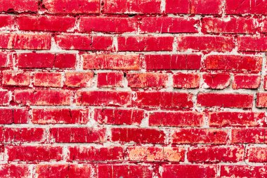 Çatlakları ve çizikleri olan tuğla duvar dokusu arka plan olarak kullanılabilir.