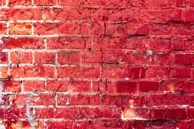 Çatlakları ve çizikleri olan tuğla duvar dokusu arka plan olarak kullanılabilir.