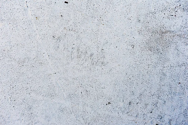 Çatlakları ve çizikleri olan beton bir duvarın dokusu arka plan olarak kullanılabilir.